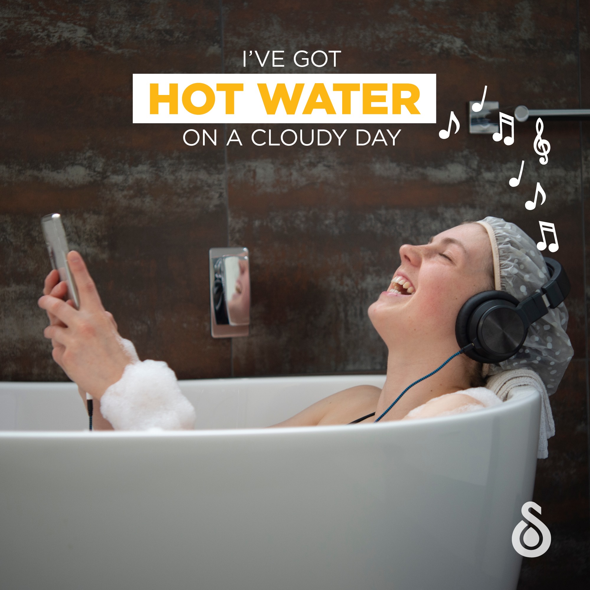Woman laughing in the bath listen to headphones